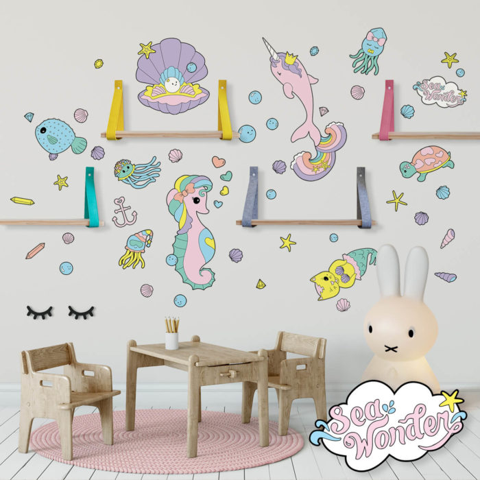 Sea creature wall decals in a girly playroom.