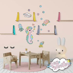 Sea creature wall decals featuring baby seahorse, turtle and squid in a baby nursery.