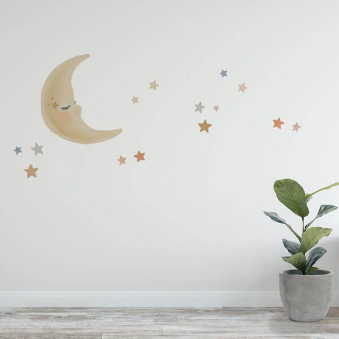Moon and stars watercolour wall decals in a child's nursery.
