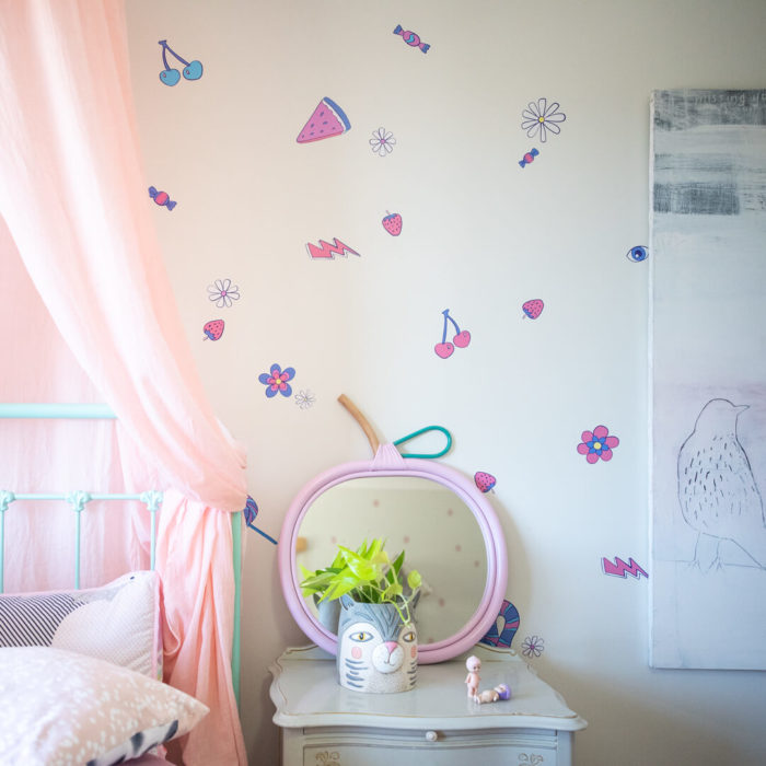 Close up of wall decals in a girly bedroom.